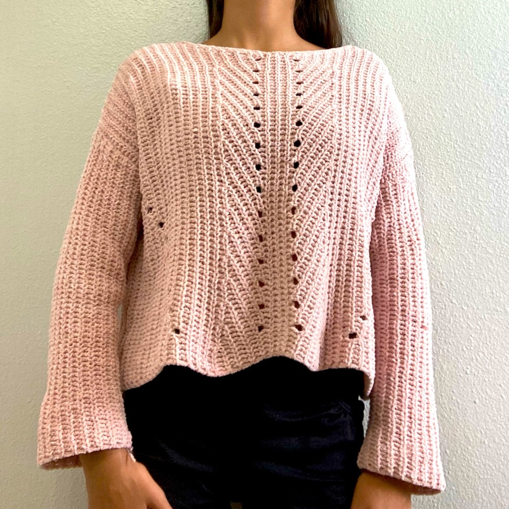 A pink knitted sweater